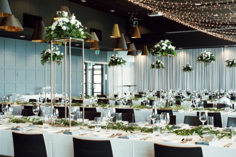 banquet tables setup, green and white flowers