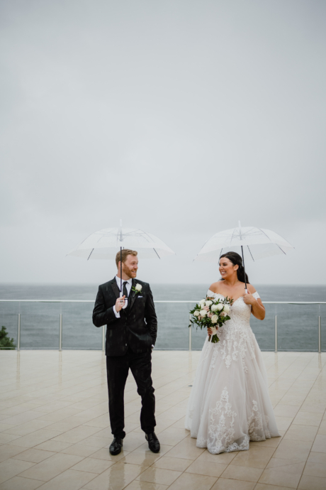 bride + groom rain photos by the water